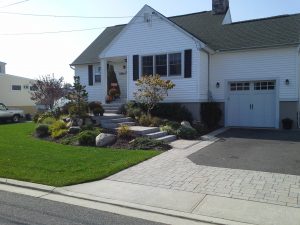 Babylon Landscape Design with custom masonry and plantings by Anchor Landscape